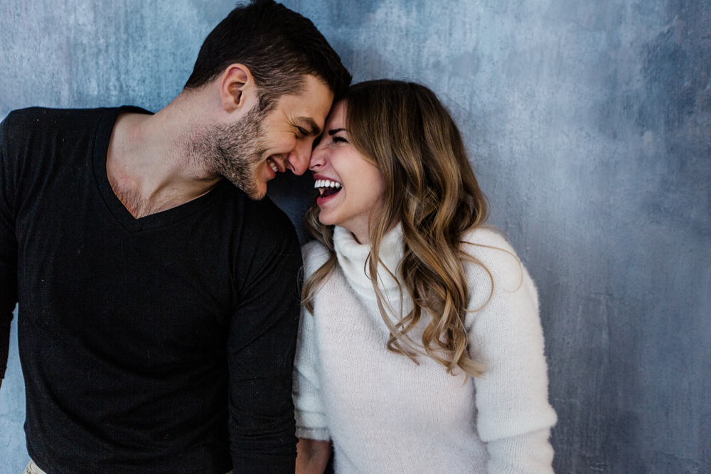 Romantic Valentine's Day Ideas | Image shows a happy couple smiling at each other