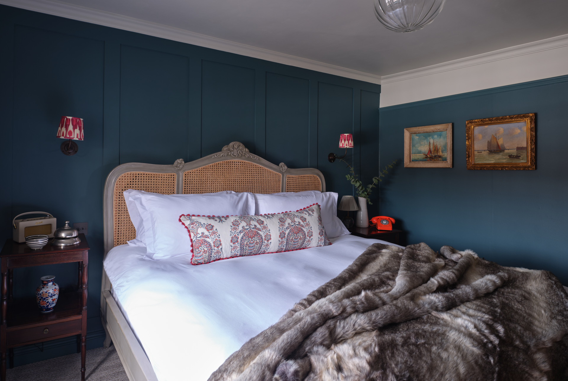 Luxury Hotel Rooms | A double bed with a luxury throw at Stanwell House hotel.